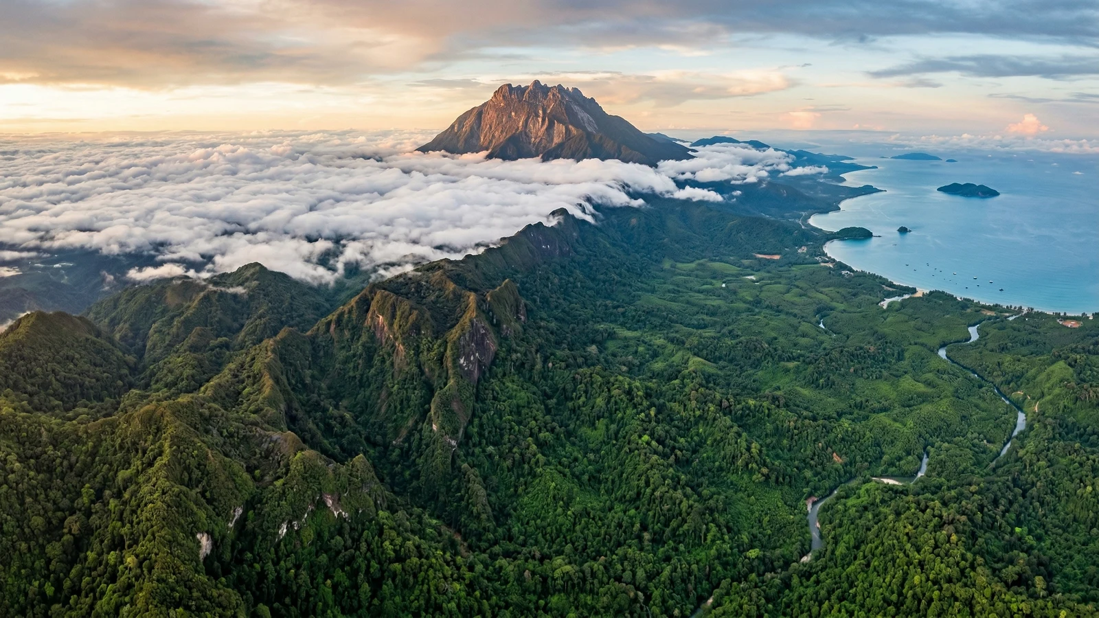 Aerial view of Sabah’s coastline with turquoise waters and forested mainland